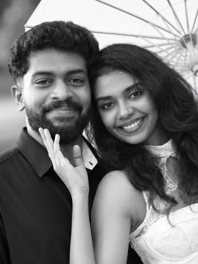 Close-up of Abhijith and Aiswarya cheek to cheek, smiling